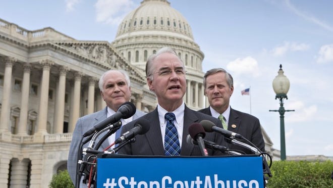 Rep. Tom Price, R-Ga., center, flanked by Rep. Mike Kelly, R-Pa., left, and Rep. Mark Meadows, R-N.C., speaks during a news conference after the 40th vote by House Republicans to repeal the Affordable Care Act. (AP Photo/J. Scott Applewhite)
