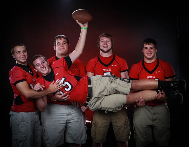 Fort White High School seniors Andrew Baker (12),A.J. Kluess (70), Kellen Snider (7), Chris Waites (61) and Caleb Bundy (85) pose for a portrait during the high school media day at The Gainesville Sun on Tuesday, July 23, 2013, in Gainesville, Fla.