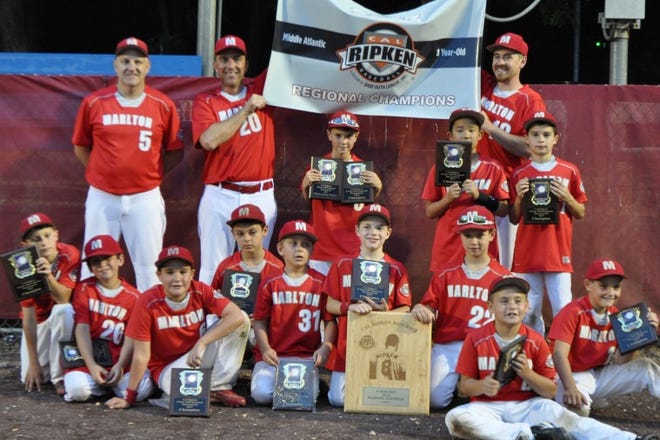The Marlton Reds won the Mid-Atlantic Region championship in Cal Ripken baseball for 8-year-olds, finishing first in a 10-team field consisting of teams from Delaware, Maryland, New Jersey, New York and Pennsylvania. The Reds compiled a 31-6 record overall and won Southern New Jersey District 5 and state titles prior to the regional tournament. Team members are (front, from left) Evan Brown, Nick DeFord, Colin Kelleher, Jack Lenihan, Brandon Prince, Chase Bimmer, Jason Schooley, Brandon Petrick, Nick Dormer, (back) head coach Tom Bimmer, coach Bob DeFord, Jeremy Cheeseman, Christian Park, coach T.J. Mann and Freddy Collender.