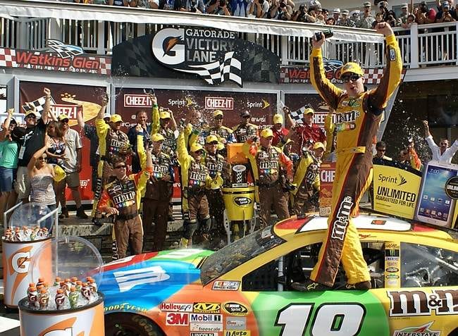 Kyle Busch celebrates in victory lane Sunday after winning the Cheez-It 355 at The Glen.
