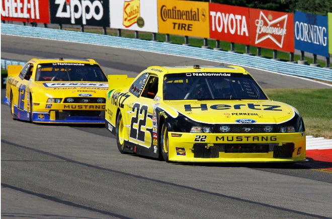 Brad Keselowski (22) leads Sam Hornish Jr. during the NASCAR Nationwide Series race at Watkins Glen on Saturday. Keselowski went on to win the race and Hornish finished second.