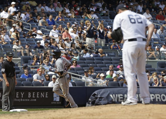 Detroit Tigers' Torii Hunter (48) runs the bases after hitting a three-run home run off of New York Yankees relief pitcher Joba Chamberlain (62) during the sixth inning of a baseball game Saturday, Aug. 10, 2013, in New York. ()
