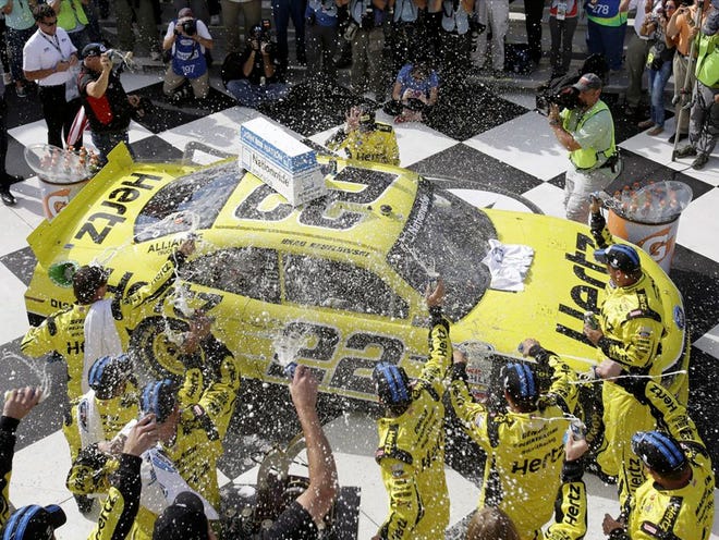 Brad Keselowski celebrates in Victory Lane at The Glen on Saturday after winning a Nationwide Series race. 
(Mel Evans | The Associated Press)