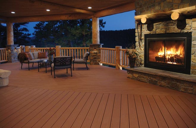 The addition of a fireplace can transform your deck into an outdoor gathering spot and a scene-stealing area for those cool nights.