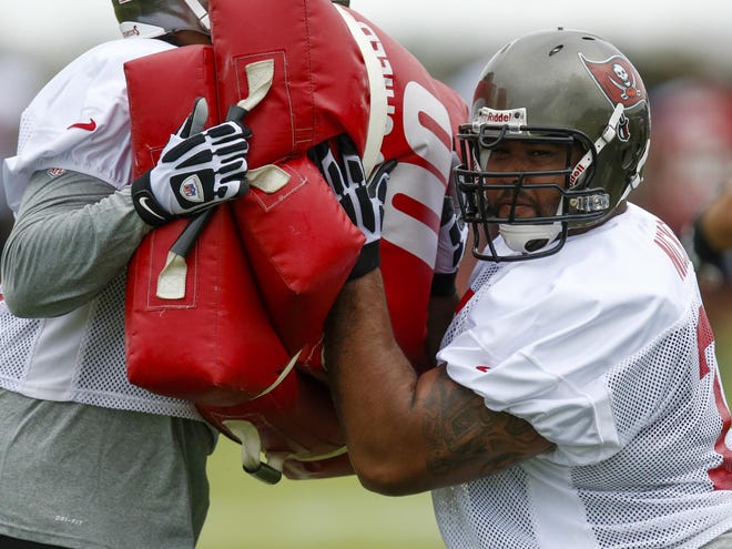 In this July 25, 2013 file photo, Tampa Bay Buccaneers guard Carl Nicks participates in a drill during NFL football training camp in Tampa.