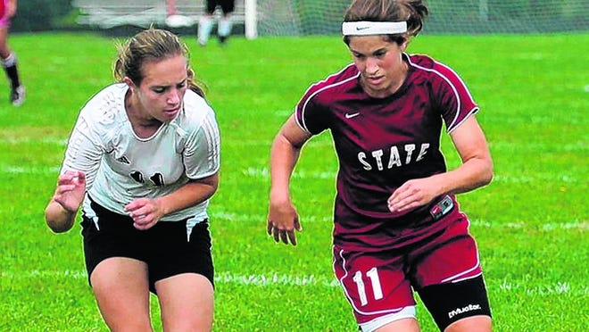 Emily Peters, shown at right playing soccer for State College High School at 
a 2008 match in Fairview, Penn., says she suffers lasting effects from four 
concussions. Girls and women are more likely to suffer concussions than boys 
and men in comparable sports, take longer to heal and have more symptoms 
afterward. PHOTO BY TOM MINCEMOYER