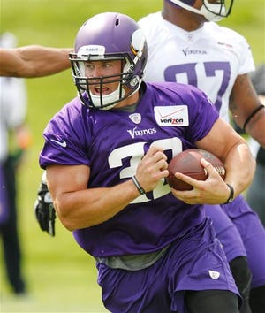 FILE - In this June 18, 2013 file photo, Minnesota Vikings running back Toby Gerhart (32) runs the ball during NFL football minicamp in Eden Prairie, Minn. Assuming NFL MVP Adrian Peterson handles the bulk of the ball carrying again for the Minnesota Vikings this season, his backup can at least tout his health as a selling point when he becomes a free agent next spring.