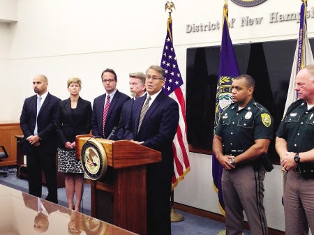 U.S. Attorney John Kacavas, center, is joined by law enforcement personnel at a press conference Wednesday following the plea hearing of David Kwiatkowski.