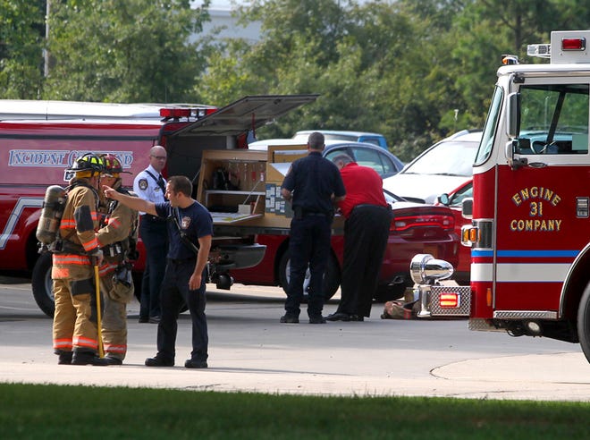 Shelby Fire Department and Cleveland Volunteer Fire Department investigate a fire inside Metals America on Thursday.