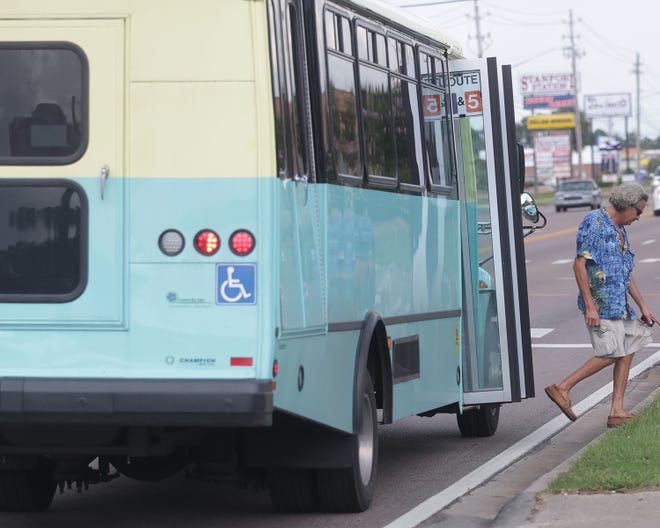A man exits the trolley at Stanford Road and 23rd Street earlier this month.