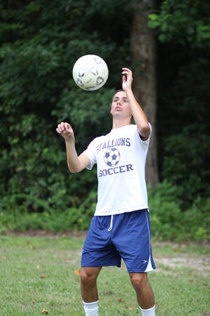 Southwest junior midfielder Paul Bishop keeps his eyes on the ball during a drill during a recent practice. Bishop played football as a freshman, but now is a key cog for the school’s soccer team.