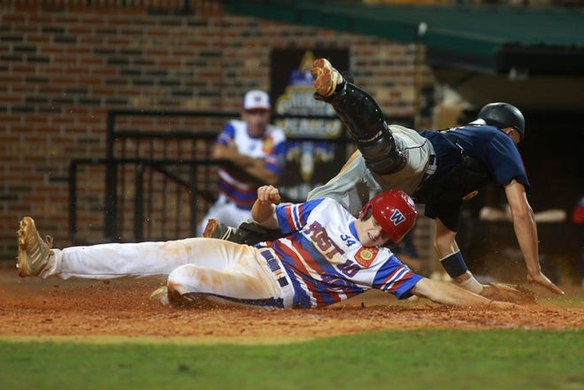 Wilmington runner Steven Linkous upends Branford, Conn., catcher Alexander Pantani to score in Friday's final game of the opening day at the American Legion World Series in Shelby. The N.C. champs secured a 5-0 victory.