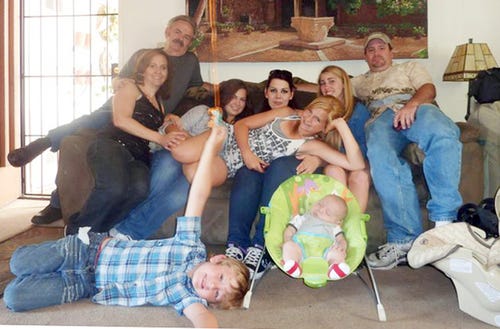 ASSOCIATED PRESS FILE PHOTO A June 2011 photo provided by Andrea Saincome shows Hannah Anderson, center, reclining across the laps of others, and James Lee DiMaggio, right, along with other members of the Anderson and Saincome families. Seated from left are Christina Anderson; Christopher Saincome; Christina’s sisters, Samantha and Andrea Saincome; their niece Hannah, reclining; Alexi (last name unavailable, friend of Hannah’s), and DiMaggio. On the floor are Ethan Anderson, left, and Andrea’s infant child, whose name was not provided.
