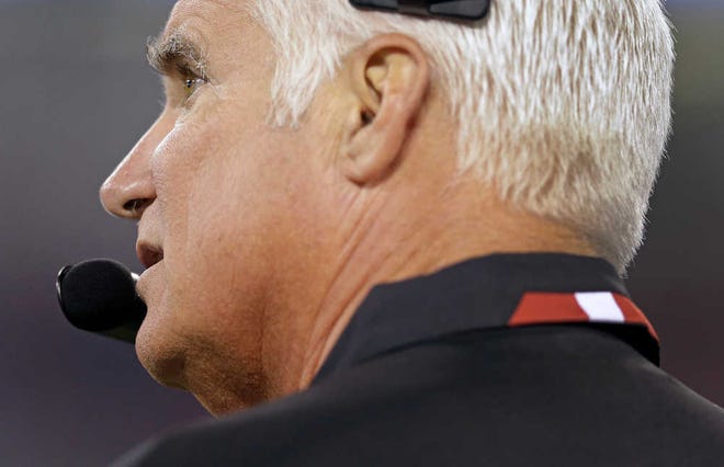 Atlanta Falcons head coach Mike Smith watches the action on the field during the first half of a preseason NFL football game against the Baltimore Ravens in Baltimore, Thursday Aug. 15, 2013. (AP Photo/Patrick Semansky)