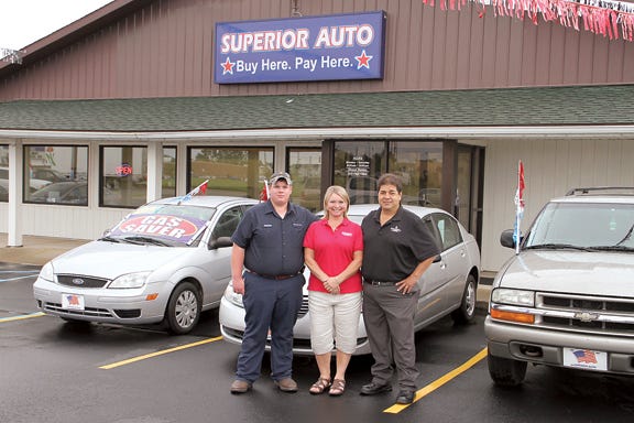 Superior Auto’s staff includes, from left, detailer and mechanic Dakota Eaton, account representative Betsy Chamberlain and manager Jesse Perez. The used-car dealership is at 1223 E. U.S. 223 in Adrian.