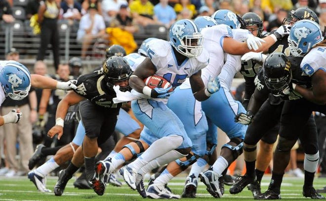 With Giovani Bernard off to the NFL, North Gaston product A.J. Blue and UNC's backfield believe they can pick up the slack for this year's running game.
