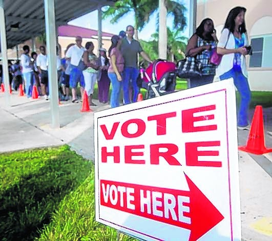 Voters turn out for early voting in Pembroke Pines last October. Among 
county election officials, the desire to root out ineligible voters is 
tempered by worry over purging legal ones.
AP ARCHIVE / 
OCTOBER 201