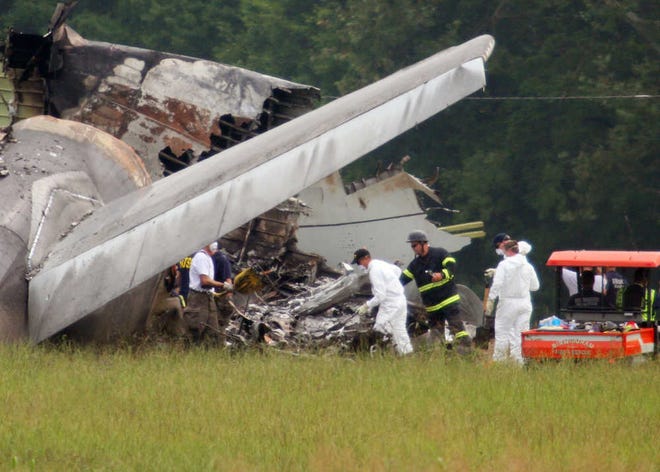 National Transportation Safety Board investigators work Thursday around the tail section of the UPS cargo plane that crashed Wednesday on approach to the Birmingham-Shuttlesworth International Airport in Birmingham, Ala.