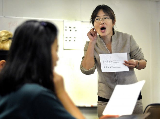 Haiying Liu is from China teaching a Chinese language class at Lansdale Catholic HS. Art Gentile/Staff photographer