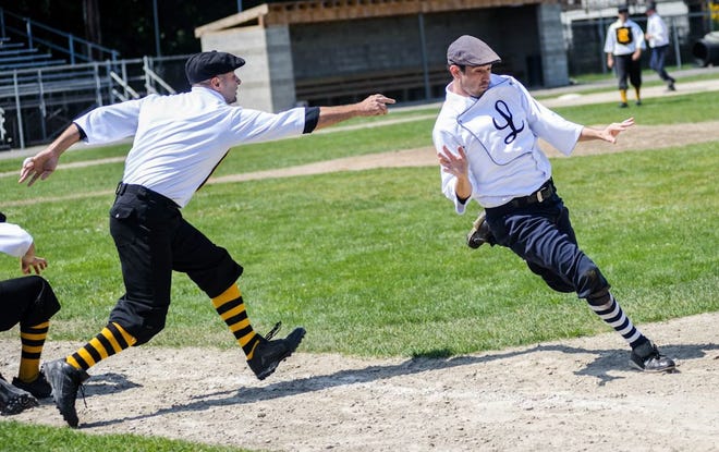 Rob Michaud of the Lowell Base Ball Nine, right, dodges Jim Champey of the Portsmouth Rockinghams to make it to first base Saturday at Leary Field. Both teams take part in re-creations of 19th century baseball.