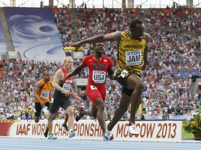 Jamaica's Usain Bolt, right, goes to cross the finish line ahead of United States' Justin Gatlin, second from right, and Germany's Martin Keller in the women's 4x100-meter relay final at the World Athletics Championships in the Luzhniki stadium in Moscow, Russia, Sunday, Aug. 18, 2013. (AP Photo/Matt Dunham)