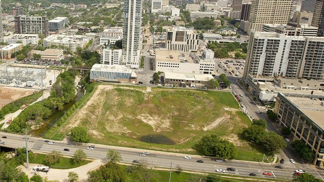 Four trees, previously slated for removal, will be spared at the site of the former Green Water Treatment Plant. Developer Trammell Crow redesigned a planned high-rise to accommodate the trees.