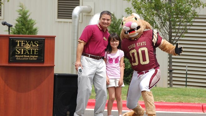 Louis de Virgilio (pictured with his daughter, Natasha and Boko, the Texas State mascot) grew up in Hawaii and was onboard at the Texas State Round Rock Campus when it was run out of four portable buildings, with only 12 computers.