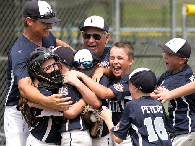 Visalia, Calif. coaches and players celebrate after defeating South Lexington, Ky., 5-4 in 7 innings Saturday morning in the Cal Ripken Would Series 10U at the Rotary Sportsplex in Ocala. The series is one of many instances of Ocala's tourism industry.