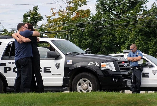 The victim of an attempted robbery in Bensalem on Rockhill Drive outside of the Neshaminy Mall is hugged after speaking with police about the incident on Monday morning.