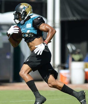Kelly.Jordan@jacksonville.com Receiver Cecil Shorts makes a catch during training camp Aug. 2. Shorts, who is nursing a calf injury, practiced Monday for the first time since Aug. 5