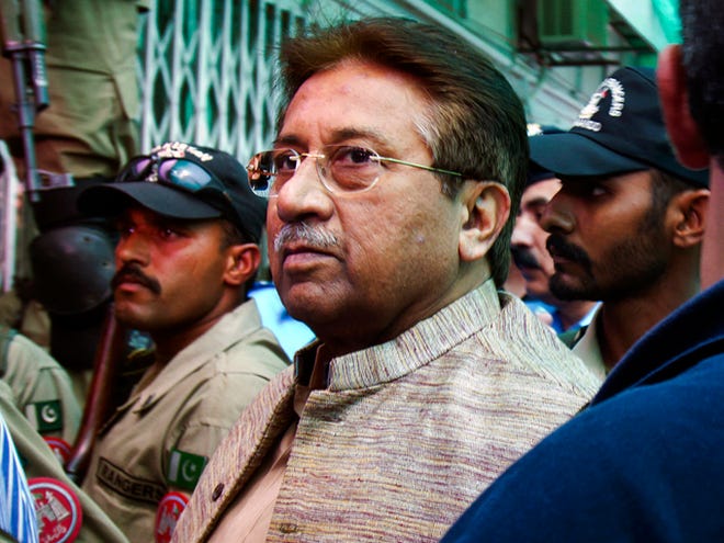 Pakistan's former president and military ruler Pervez Musharraf arrives at an anti-terrorism court on April 20 in Islamabad, Pakistan. A Pakistani court Tuesday indicted Musharraf on murder charges in connection with the 2007 assassination of iconic Pakistani Prime Minister Benazir Bhutto, deepening the fall of a once-powerful figure who returned to the country this year in an effort to take part in elections.