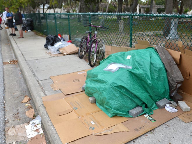 Sarasota Police officers issued notices to homeless people living along Florida Ave. that they have five days to remove their belongings from the public sidewalk or the property will be seized. Police are working with several charitable organizations to help find shelter and storage for the people who have been living at the homeless camp.