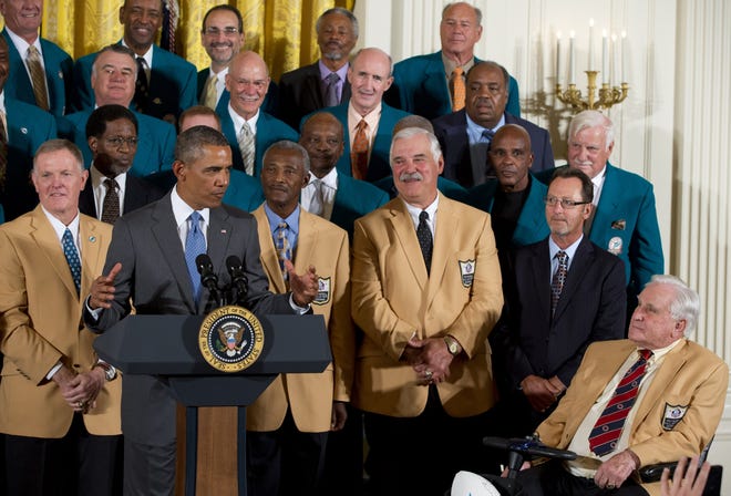 Forty-one years after their perfect football season, President Barack Obama honors the Super Bowl VII Champion Miami Dolphins in the East Room of the White House in Washington, Tuesday, Aug. 20, 2013. The 1972 Miami Dolphins remain the only undefeated team in NFL history. From left are quarterback Bob Griese, the president, wide receiver Paul Warfield fullback Larry Csonka, an unidentified man, and coach Don Shula. Otto Stowe, a 1967 Springfield Feitshans High School graduate, is seen in the top row, second from right.