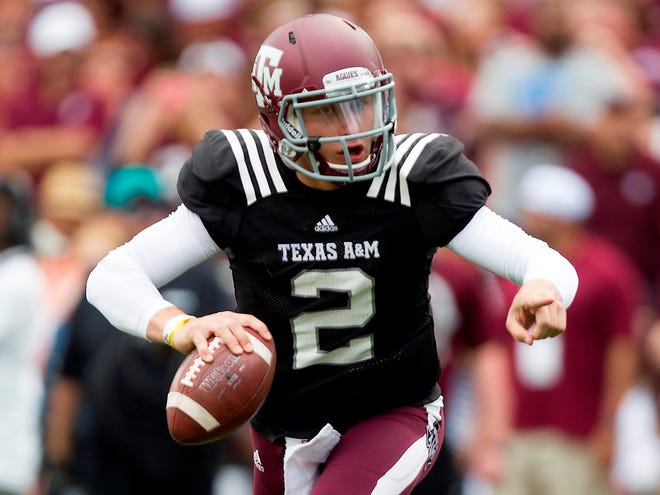 Texas A&M quarterback Johnny Manziel is still under NCAA investigation for allegedly receiving improper benefits with the Aggies less than two weeks away from their Aug. 31 opener against Rice in College Station, Texas. (AP Photo)