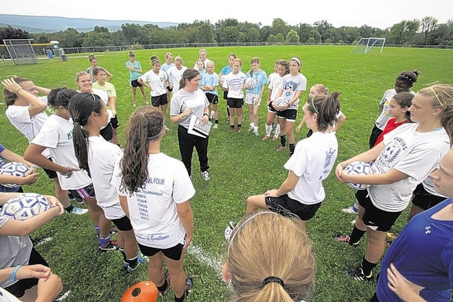 Washingtonville coach Jen Czumak lays down the law to the defending Class AA state champs, and just like last year, the first day of practice turned out to be demanding.