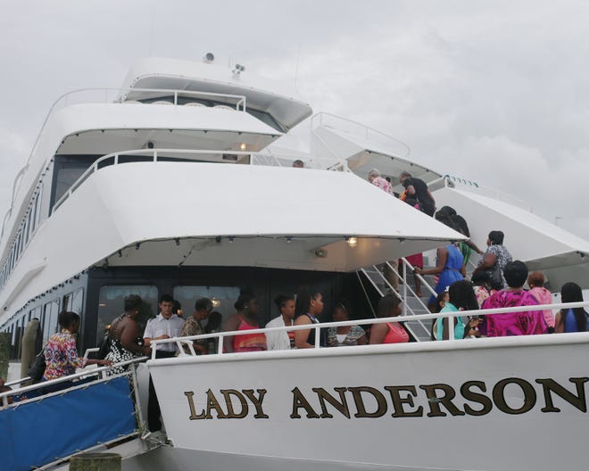 Visitors board the Lady Anderson for a dinner cruise at Capt. Anderson’s Marina in Panama City Beach on Friday.