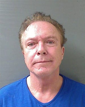 This Wednesday, Aug. 21, 2013 booking mug released by the Schodack (NY) Police Department shows actor-singer David Cassidy. Cassidy, best known for his role as Keith Partridge on "The Partridge Family," is free on $2,500 bail after being charged with felony driving while intoxicated in upstate New York. Schodack Police Lt. Joseph Belardo says Cassidy was stopped early Wednesday for failing to dim his headlights about 10 miles south of Albany. Belardo says Cassidy was charged with DWI after tests showed his blood-alcohol content at .10, higher than the state's legal limit of .08. (AP Photo/Schodack Police Department)
