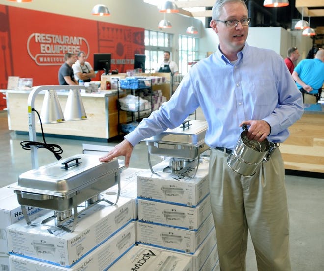 Restaurant Equippers Director of Sales Operation John Eberhart talks about chafing dishes on sale at the Pennsauken store.