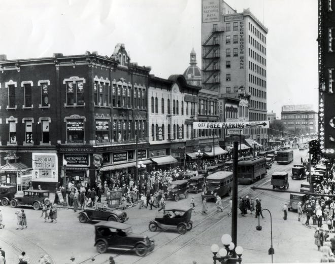 View of the 100 block of South Adams at Fulton in downtown Peoria, circa 1910.