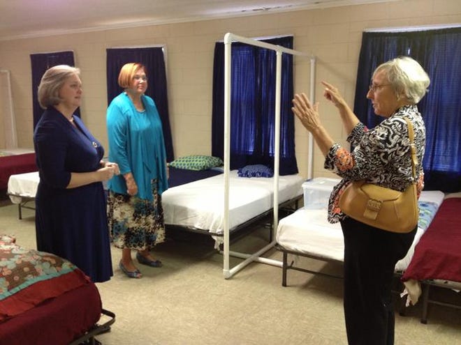 Shirley Lail talks with Cleveland County Abuse Prevention Council Inc. Executive Director Cathy Robertson, left, about the needs of the current women and children's shelter in the Star File photo.
