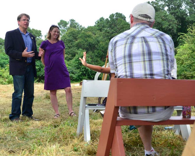 Rep. Spencer Frye, left, speaks as he stands with Heather Benham, Director of Operations for the Athens Land Trust,during a groundbreaking for a new Athens Land Trust farm at the Williams Family Farm in east Athens, Ga. on Thursday, Aug. 22, 2013.  (Richard Hamm/Staff) OnlineAthens / Athens Banner-Herald