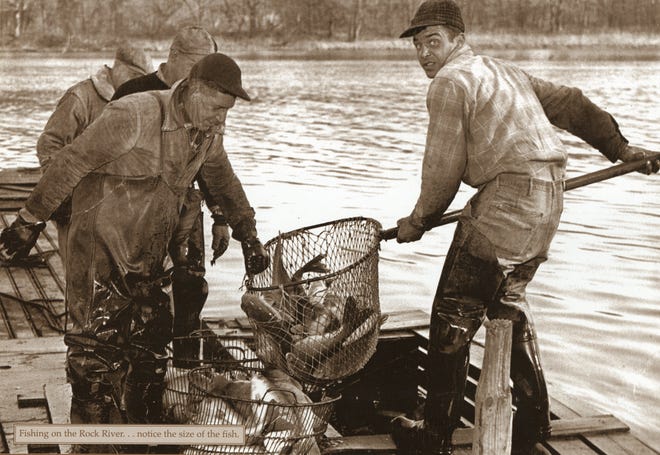 Dixon Fisheries crew hauling in a catch on the Rock River. The man on the right is the father of current Dixon's president Jim Dixon.