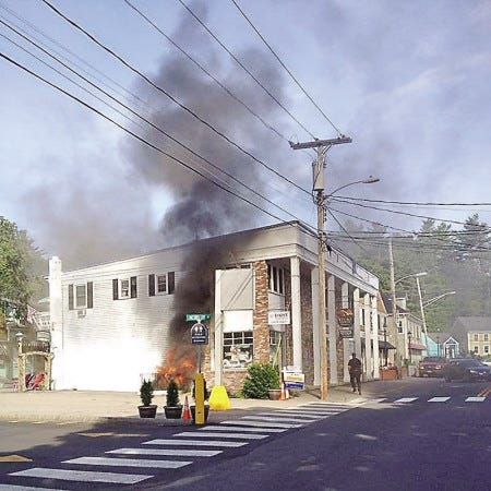 Courtesy photo
Smoke pours from the Your Body Works spa at 20 Shore Road in Ogunquit Monday morning. Two firefighters were injured in the blaze, which is still under investigation.