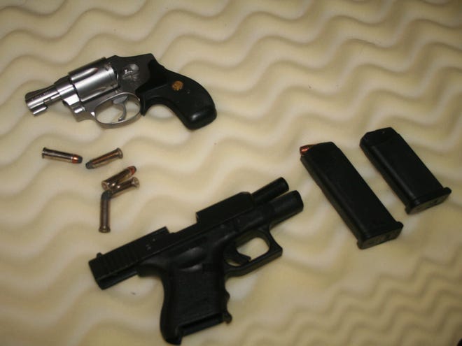 Sarasota police say they found these guns and ammunition during a search of the apartment of Terrence Timmons, 29, who faces numerous drugs and weapons charges. (Provided by Sarasota Police Department)