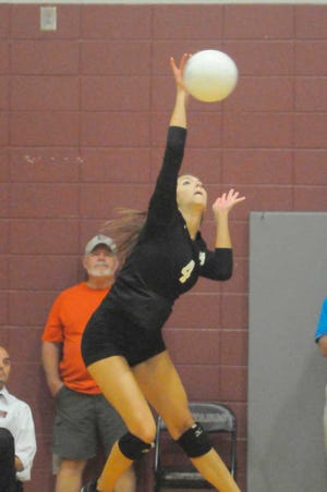 Gilbert Miller For Effingham Now Lady Mustang Kenerly Gordon makes a much needed kill shot on Aug. 13 from the left side to help her team sweep the Lady Panthers of Liberty County 25-14 in both games.