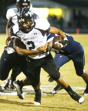 Havelock's Michael Bowman (2) fights for yardage in a 34-7 victory against Washington last season. The Rams open the season against the Pam Pack Friday night at 7:30 p.m. in Washington.