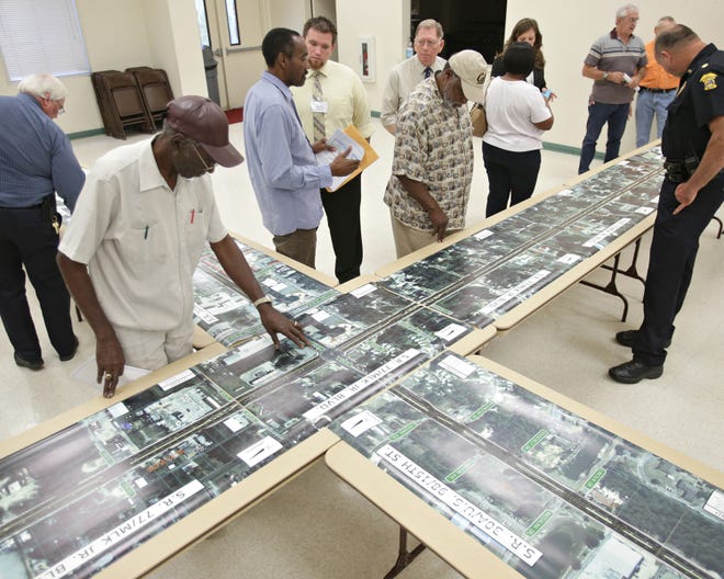 Locals inspect an enlarged map of the Florida Department of Transportation's proposed improvements to U.S. 98 and State 77 during a public information meeting in the Glenwood Community Center on Thursday.