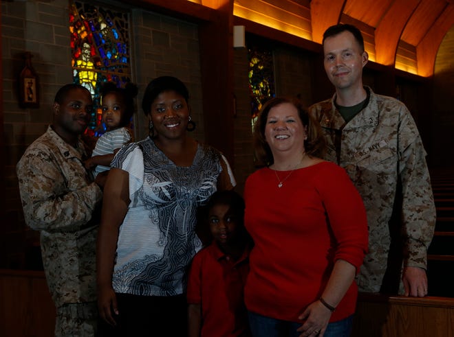 From left, Sgt. Byron Beverly holds his daughter, Lilianna, 1, beside his wife, Jennie Beverly; Xavier Beverly, 6; and Laurie and Marc Massie Tuesday afternoon. Jennie and Laurie are members of the American Military Spouses Choir, which will perform on America's Got Talent next week.