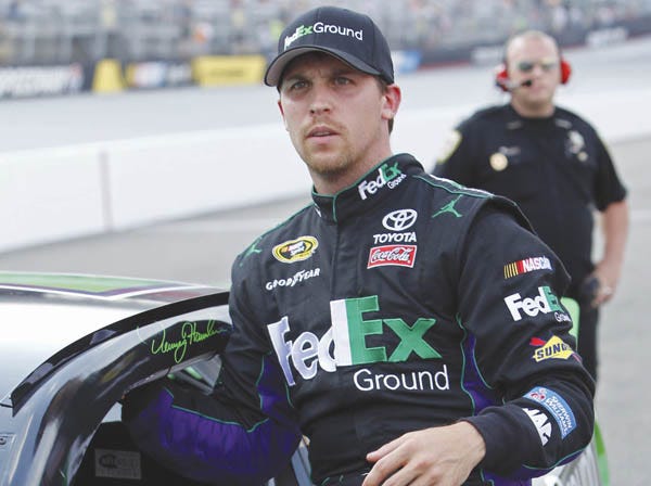 Denny Hamlin gets out of his car at Bristol Motor Speedway after qualifying Friday. (Wade Payne | Associated Press)