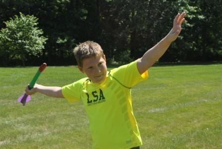 Stanton Godshall of Green Lane, 12, throws the 300-gram turbo javelin at the State Games of America National Championships.
